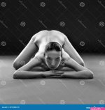 Nude Yoga. Beautiful Body of Young Woman on Black Background Stock Photo
