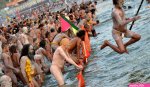 Holy men pictured bathing in rivers during Hindu festival Kumbh Mela