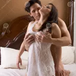 Loving Young Nude Erotic Sensual Couple in Bed Stock Image