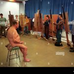 Art students painting a nude elderly man in a life class Stock Photo
