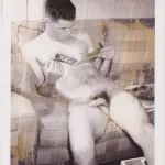 Male Nude Looking at Magazine 3: Vintage Polaroid