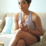 25 hot photos of Rashmika Mandanna flaunting her sexy legs in shorts dresses and high slit gowns.