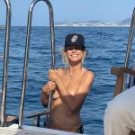 Heidi Klum goes topless while boating with Tom Kaulitz