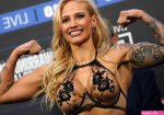 Sexiest boxer ever Ebanie Bridges shows off cleavage in very low-cut top and pr