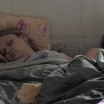 Sleeping mom baby and elder son in bed