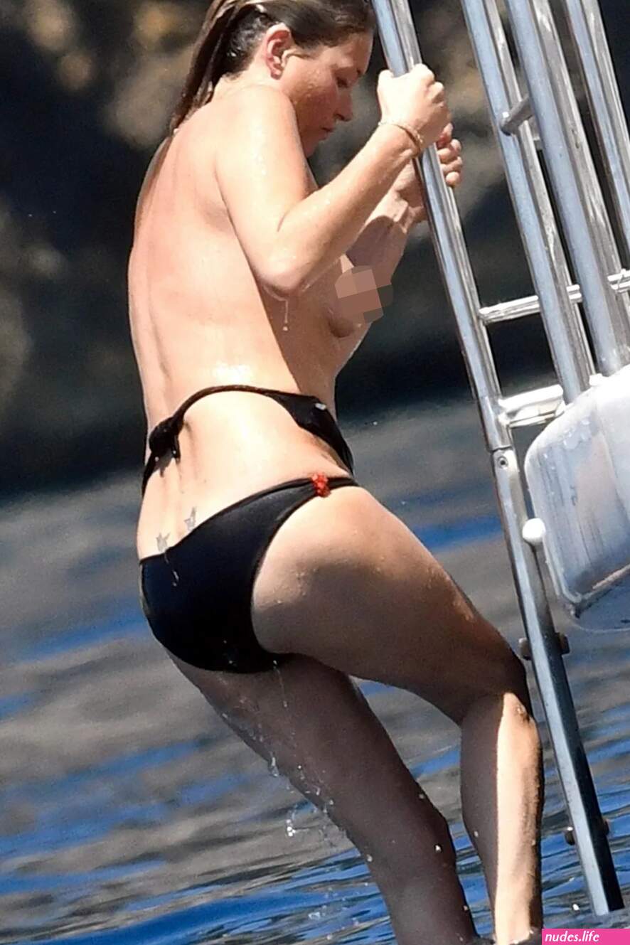 Boobs ahoy! Kate Moss accidentally exposes her BREASTS as she loses bikini top in daring dive from yacht